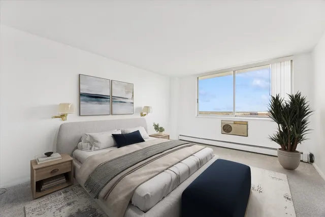 a bedroom with a large bed and a couch