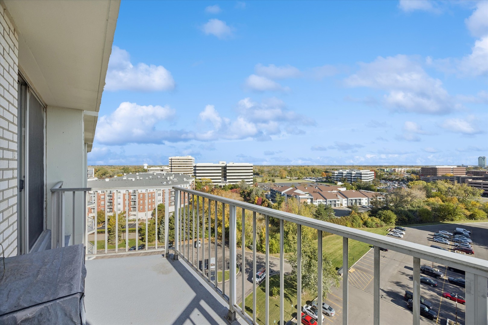 20 North Tower Road, Unit 12L Oak Brook, IL 60523 - Photo 7 of 16 a view of a city from a balcony