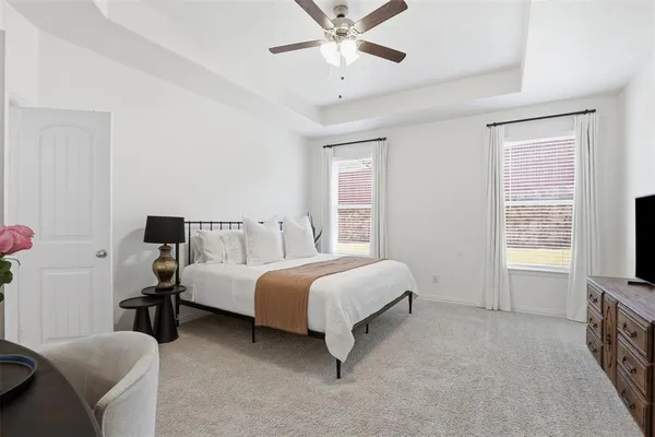 a bed room with a bed and a window