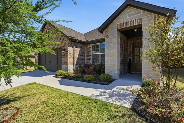 front view of a house with a yard