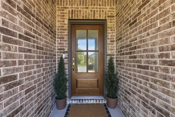 a view of a door and a window