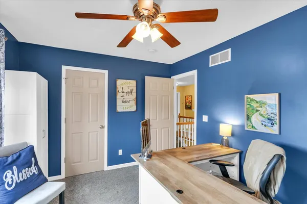 a bathroom with a sink a toilet and shower curtain