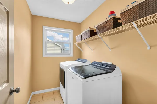 a bedroom with a bed dresser and a window