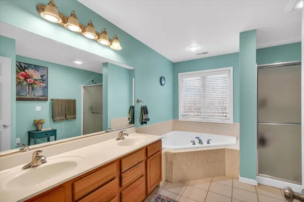 a bathroom with a bathtub and a window