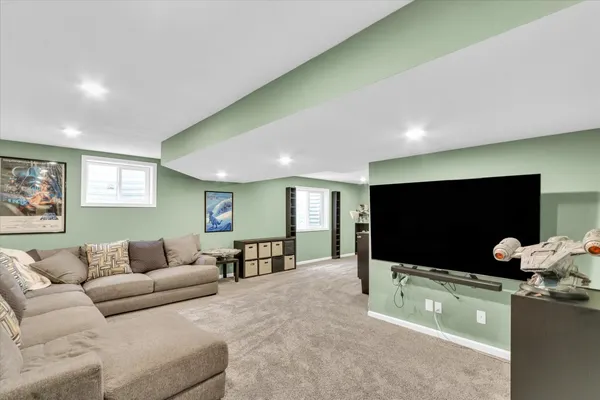a bathroom with a sink vanity mirror and toilet