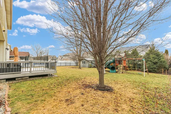 a view of a house with a large tree