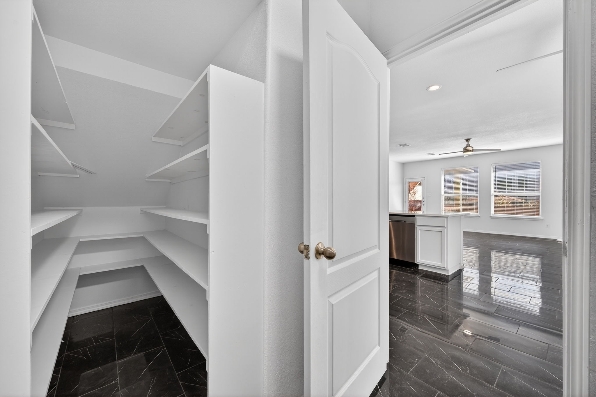 2305 Gavin Trail Pflugerville, TX 78660 - Photo 15 of 40 a view of a hallway with wooden floor and staircase