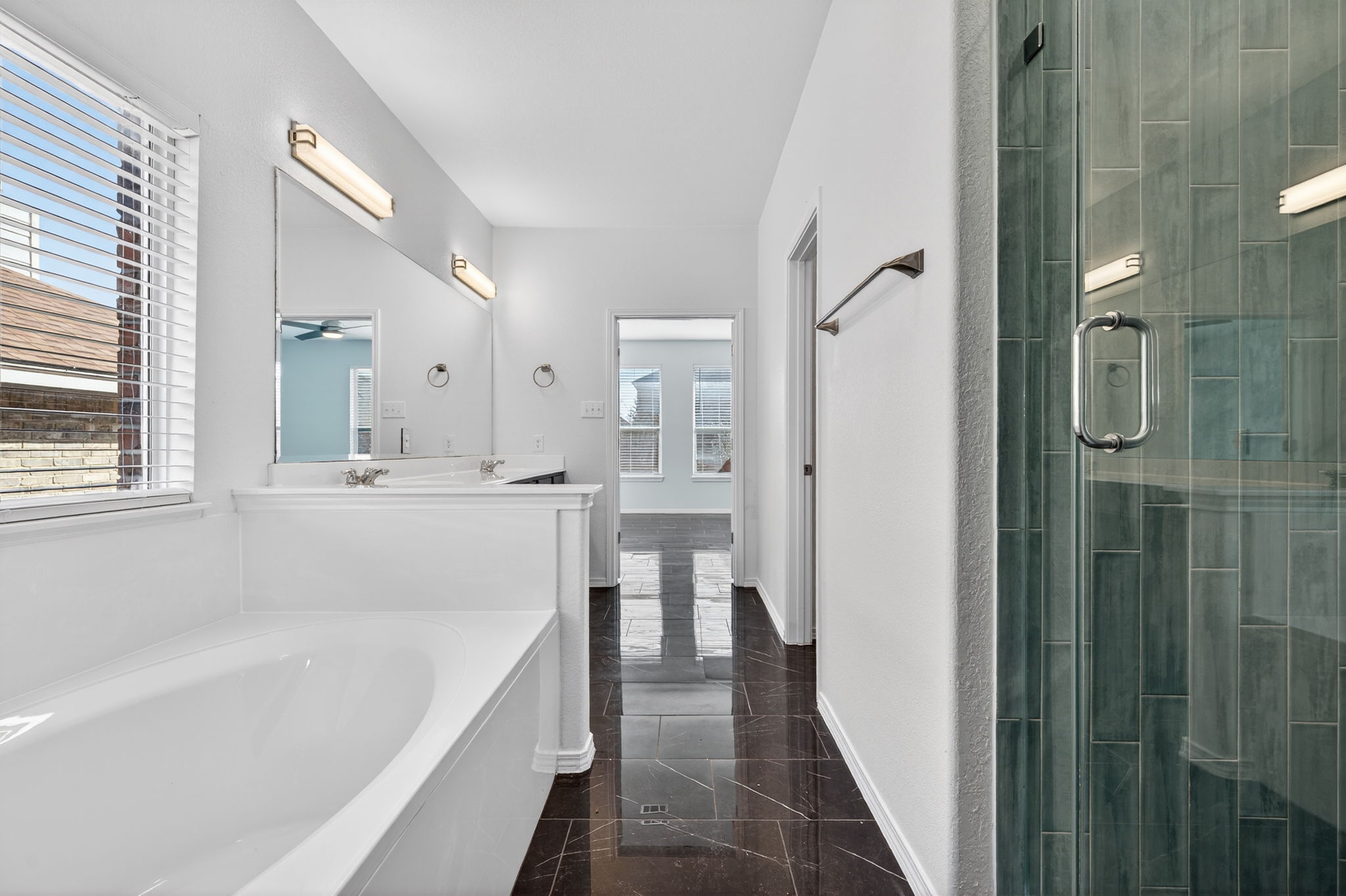 2305 Gavin Trail Pflugerville, TX 78660 - Photo 19 of 40 a bathroom with a tub shower and a sink
