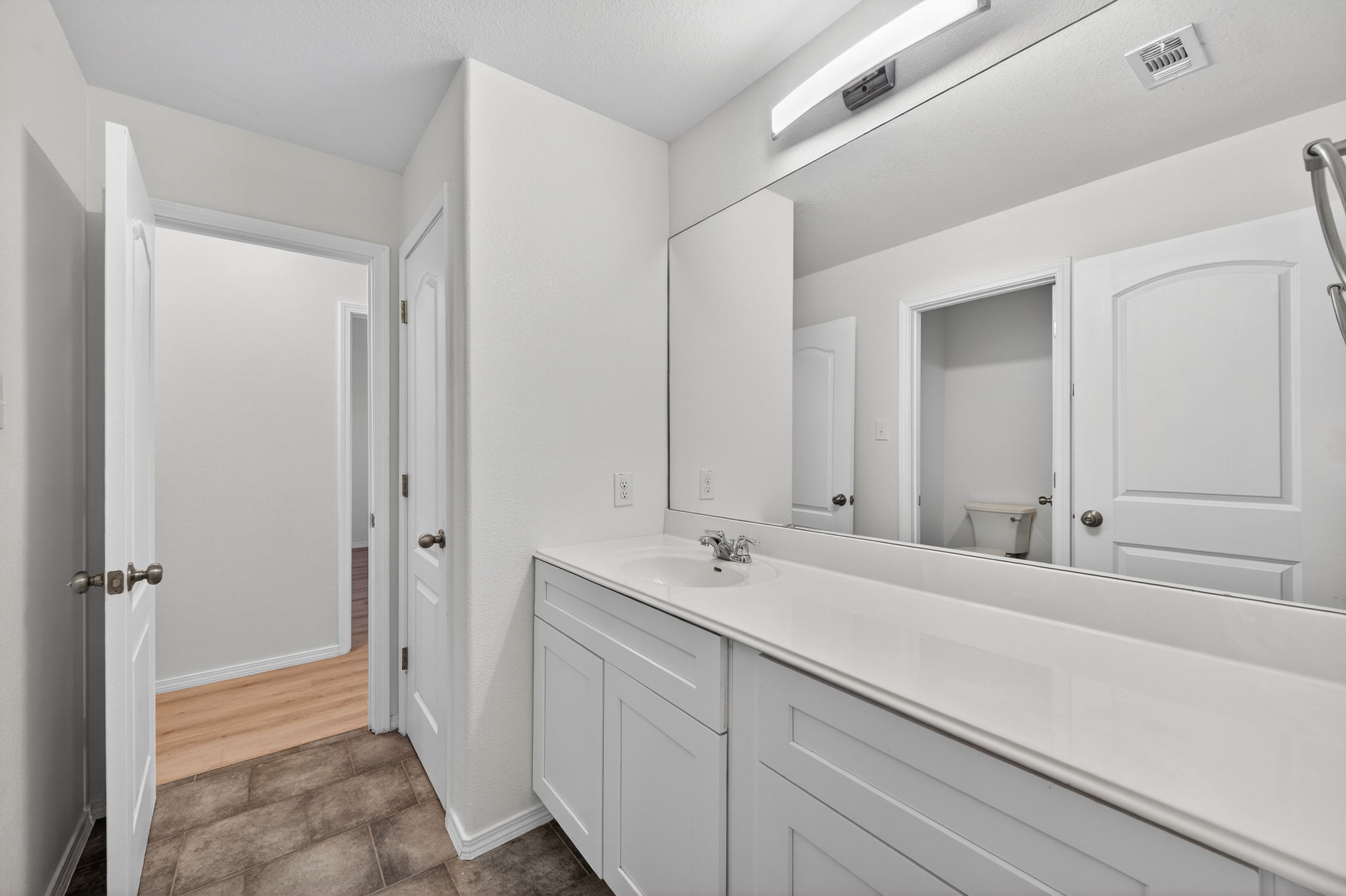 2305 Gavin Trail Pflugerville, TX 78660 - Photo 24 of 40 a bathroom with a sink and a mirror