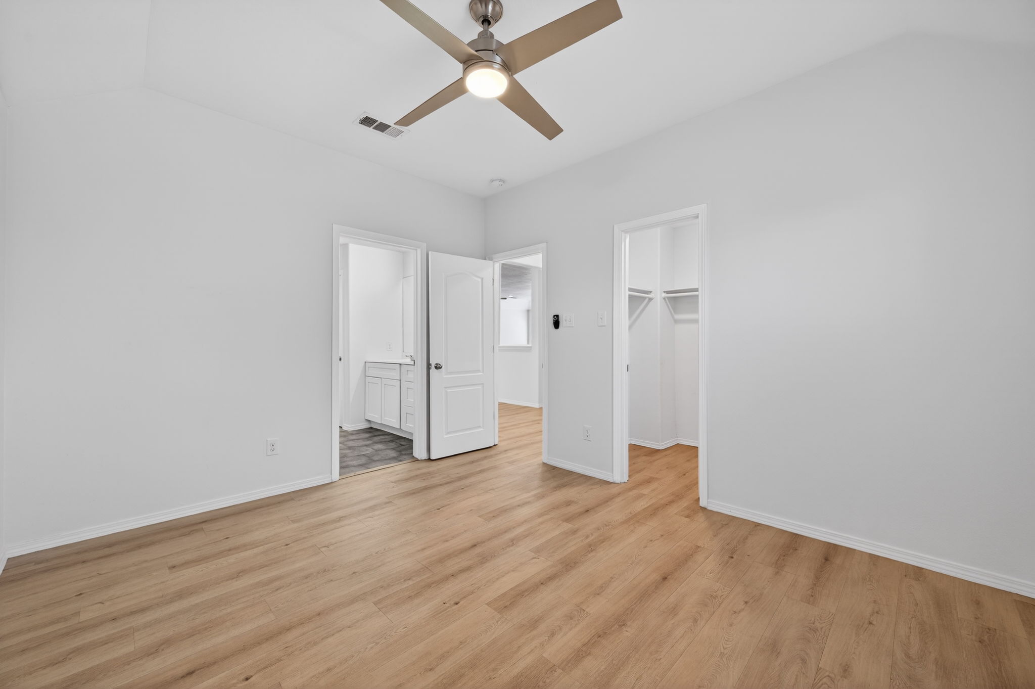 2305 Gavin Trail Pflugerville, TX 78660 - Photo 27 of 40 a view of an empty room with wooden floor