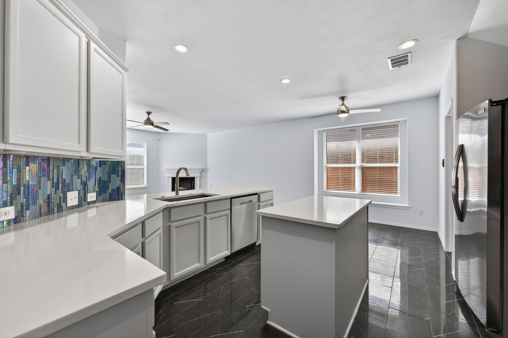 2305 Gavin Trail Pflugerville, TX 78660 - Photo 6 of 40 a kitchen with counter top space and appliances