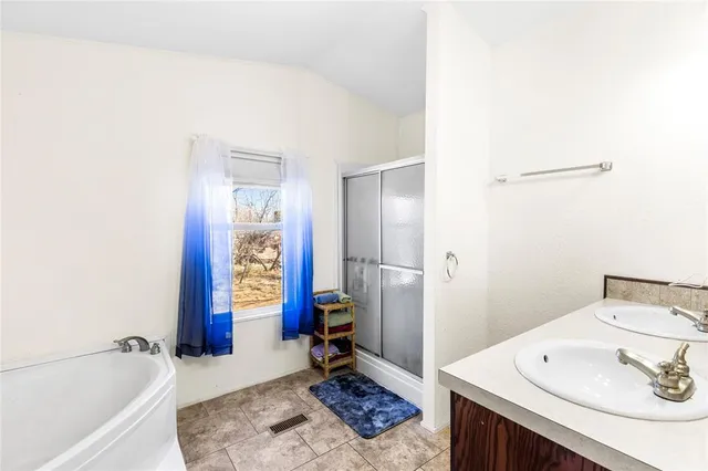 a bathroom with a bathtub and a sink