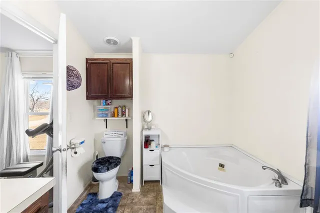 a bathroom with a sink a toilet and a bathtub