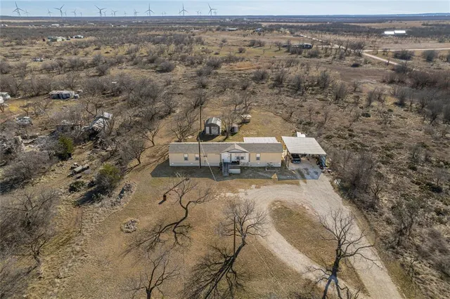 a view of a balcony with a yard