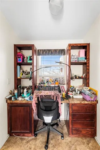 a view of a workspace with furniture