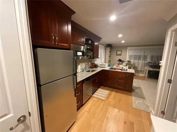 a view of a room with furniture and window