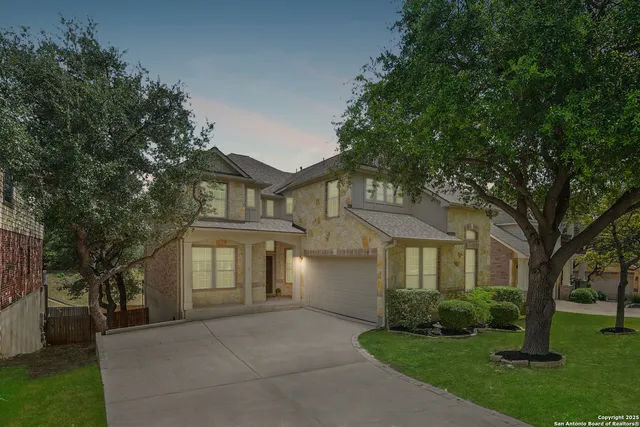a view of a brick house with large windows