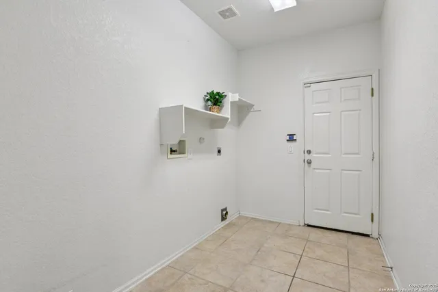 a bathroom with a toilet a sink and shower