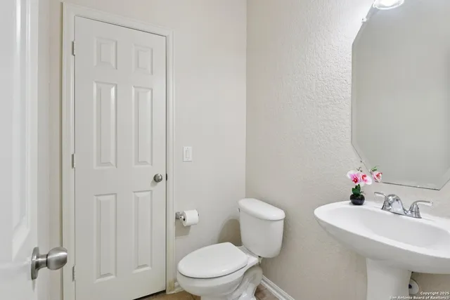 a spacious bedroom with a bed and a large window