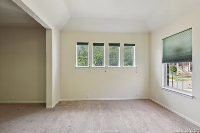 a bathroom with a granite countertop sink a mirror and a bathtub