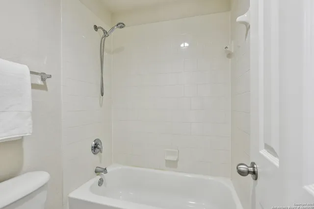 a room with a sink and cabinets