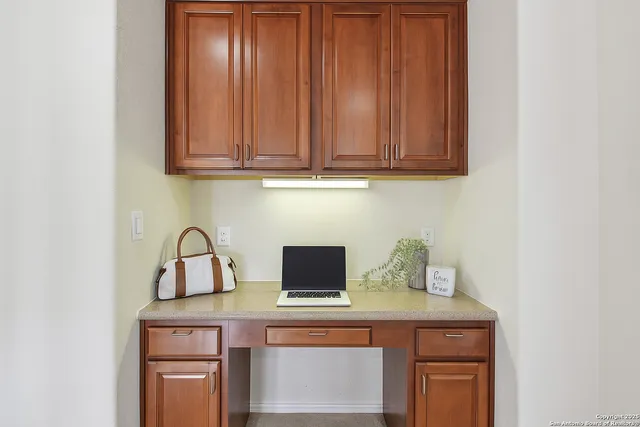 a bedroom with a bed and a chair with window