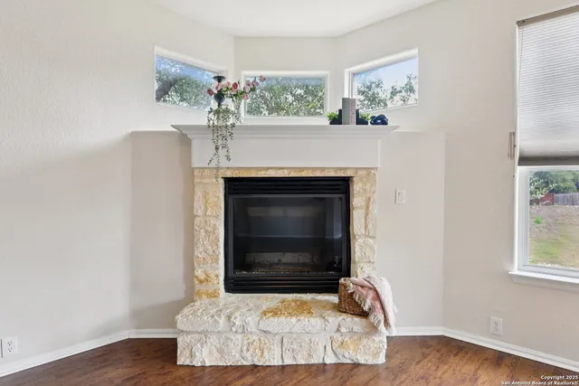 a living room with furniture a rug and a fireplace