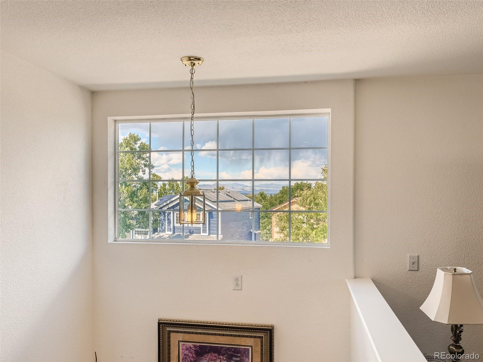 901 Riddlewood Road Highlands Ranch, CO 80129 - Photo 20 of 28 a kitchen with a window a sink and a window