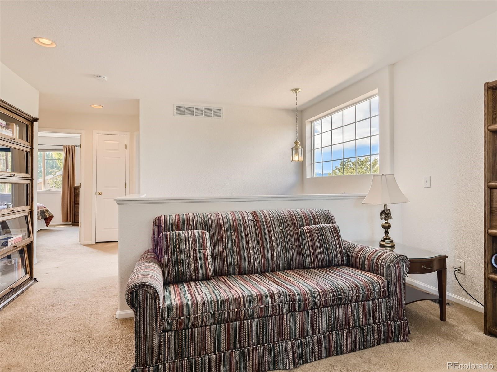 901 Riddlewood Road Highlands Ranch, CO 80129 - Photo 22 of 28 a living room with furniture