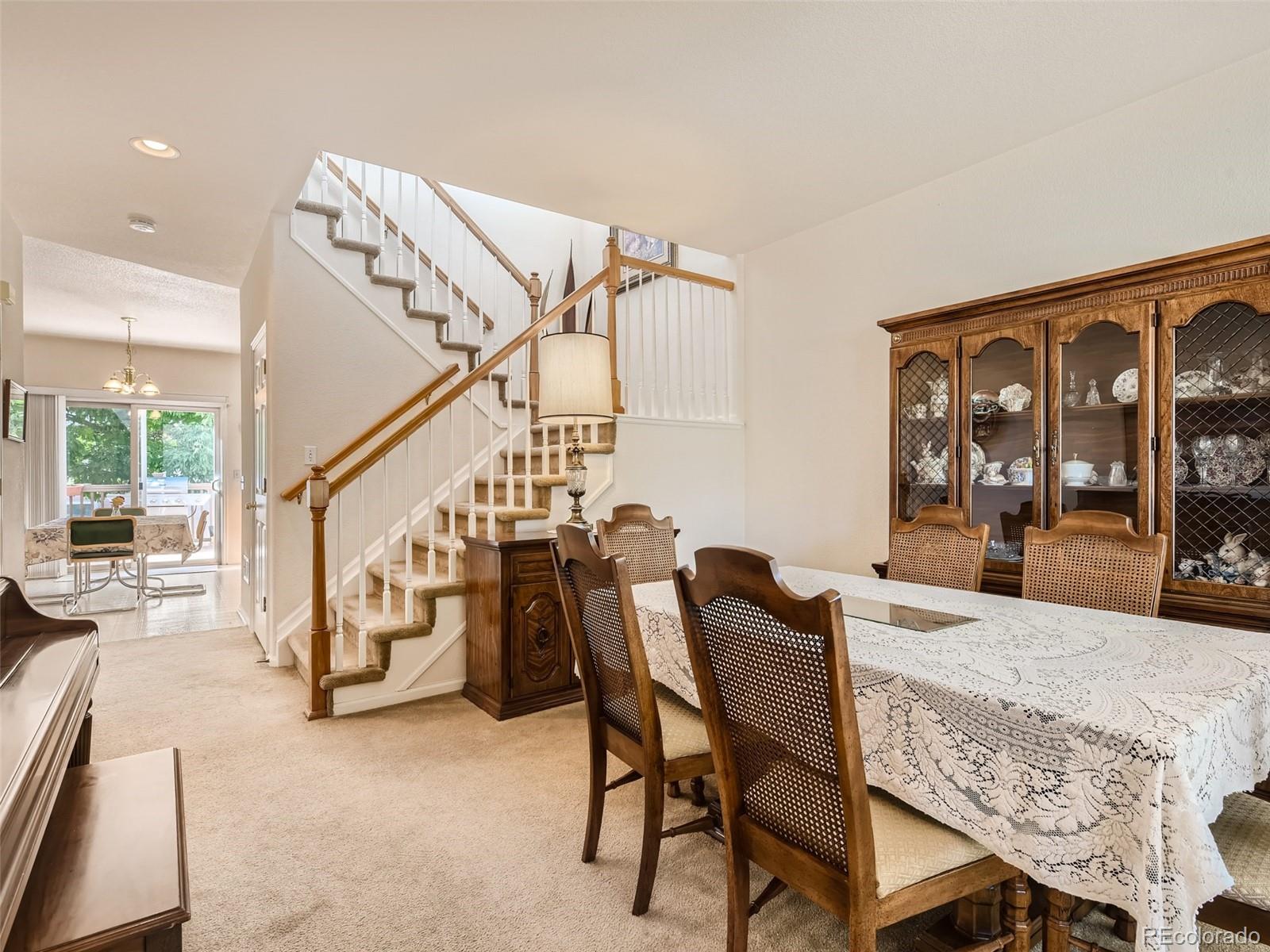 901 Riddlewood Road Highlands Ranch, CO 80129 - Photo 5 of 28 a dining room with furniture and entryway