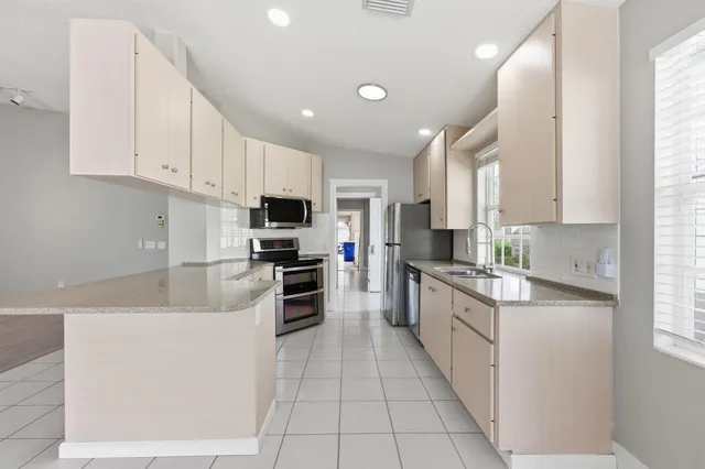 a large kitchen with cabinets