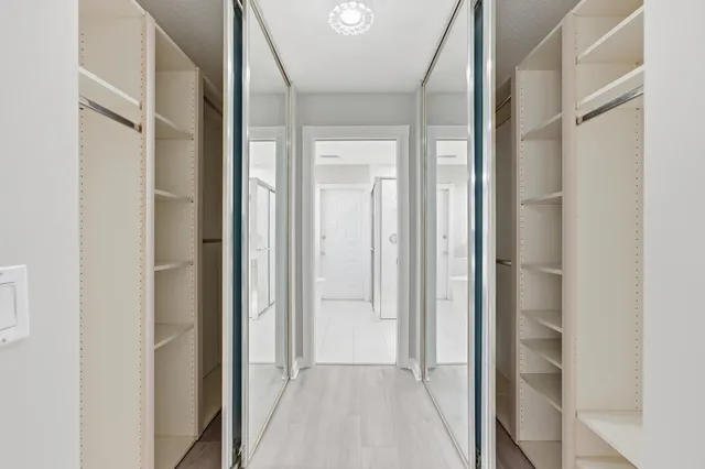 a view of a bathroom from a hallway