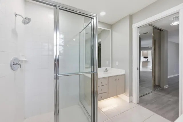 a bathroom with a shower and a sink