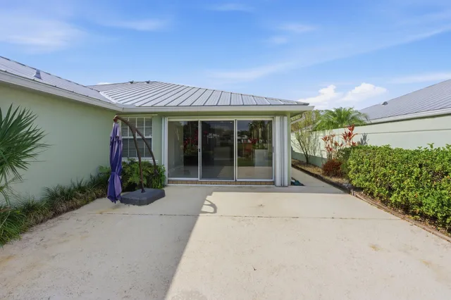 front view of a house with potted plants