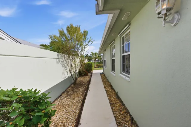 a view of a lake with houses in the background