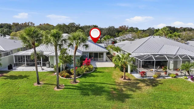 a view of a house with backyard and porch