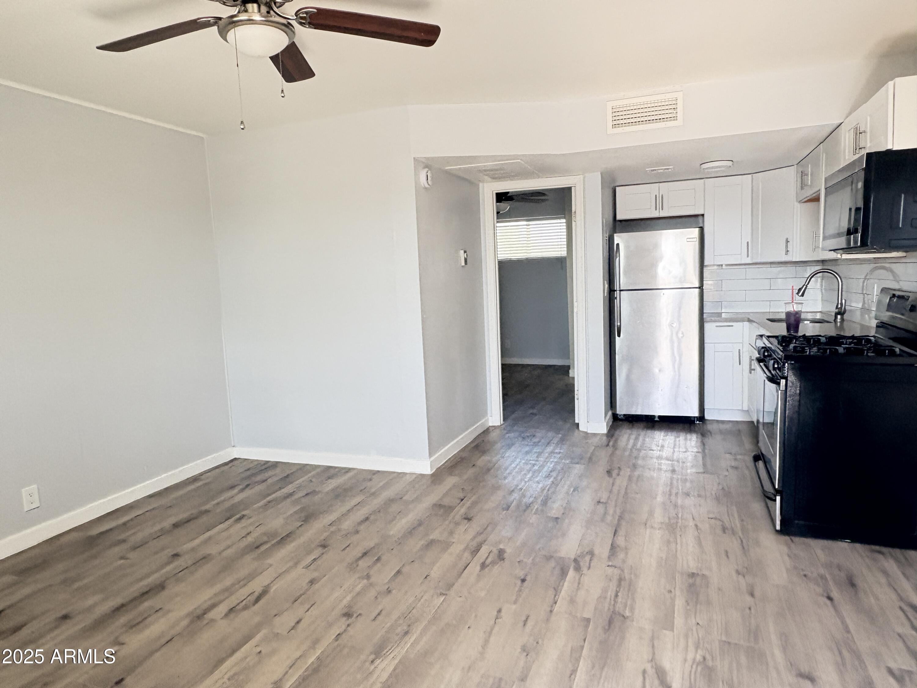 2929 North 38th Street, Unit 1 Phoenix, AZ 85018 - Photo 2 of 6 a view of a kitchen with a sink and a refrigerator