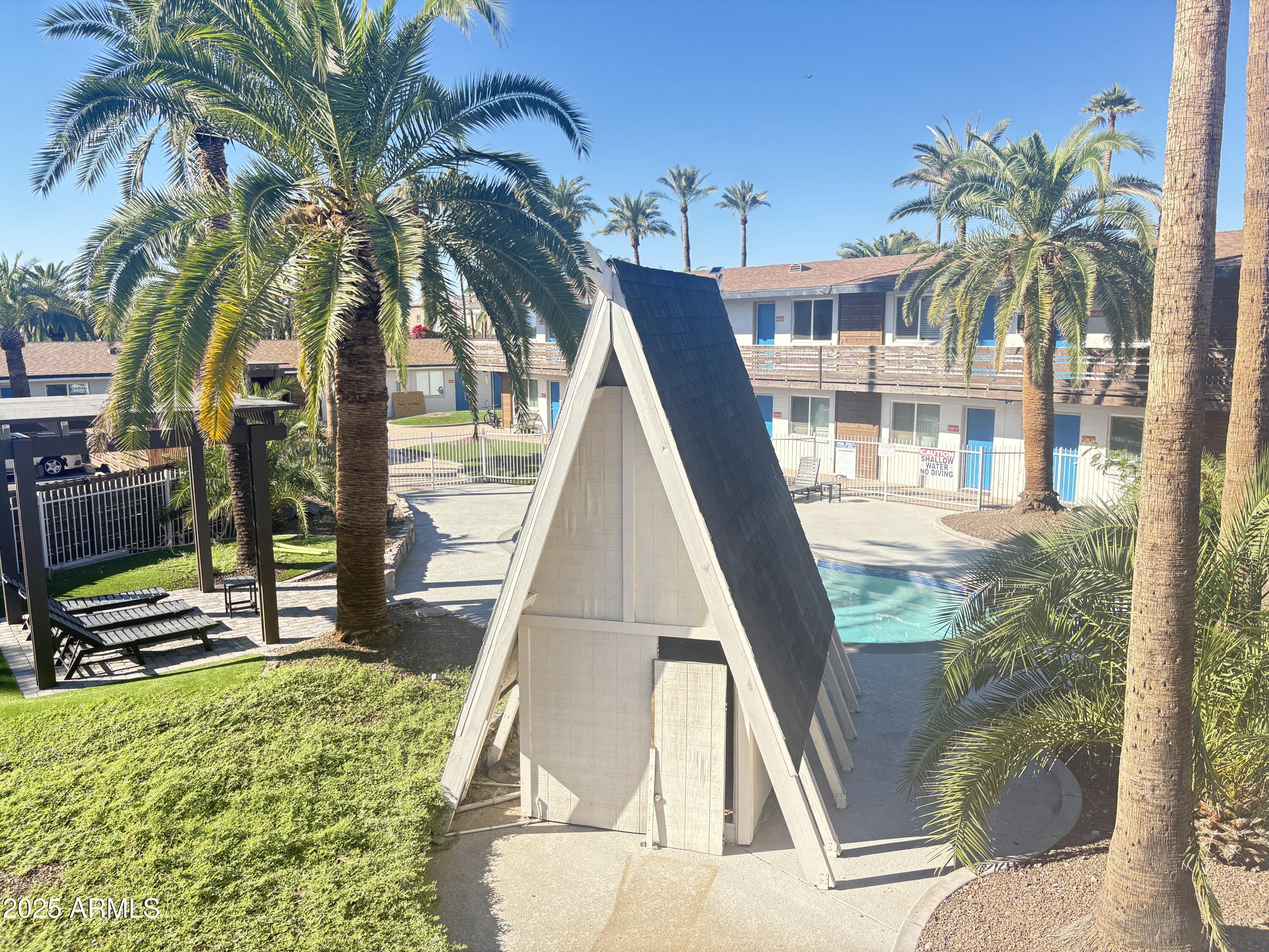 2929 North 38th Street, Unit 1 Phoenix, AZ 85018 - Photo 5 of 6 a view of outdoor space with swimming pool and furniture