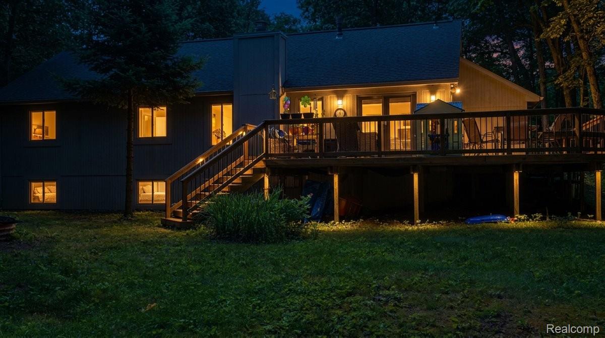 9714 Naiad Road Clarkston, MI 48348 - Photo 14 of 61 Rear exterior featuring wood deck with virtual lighting.