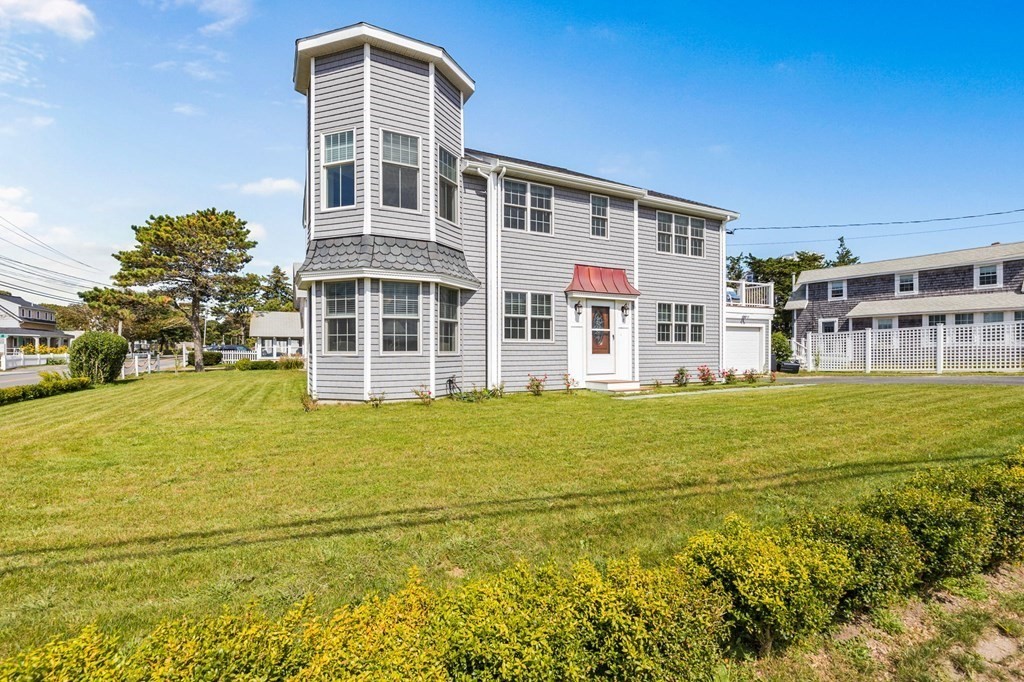 2 Chase Avenue Dennis, MA 02639 - Photo 4 of 24 a large building with a big yard and large trees