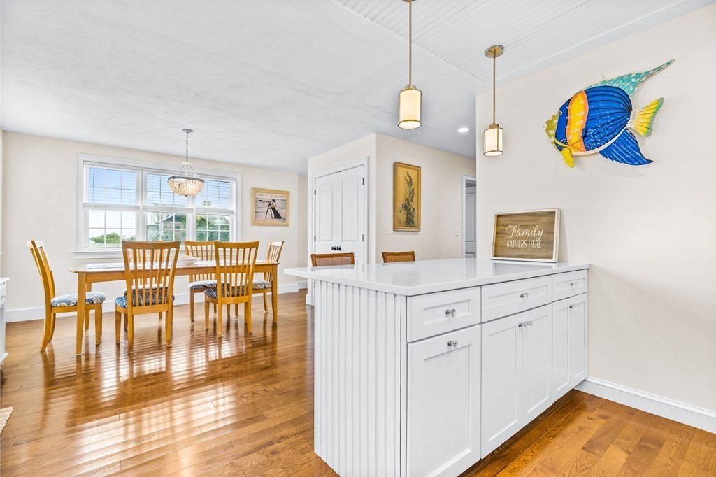 2 Chase Avenue Dennis, MA 02639 - Photo 9 of 24 a view of dining room and kitchen with a table chairs