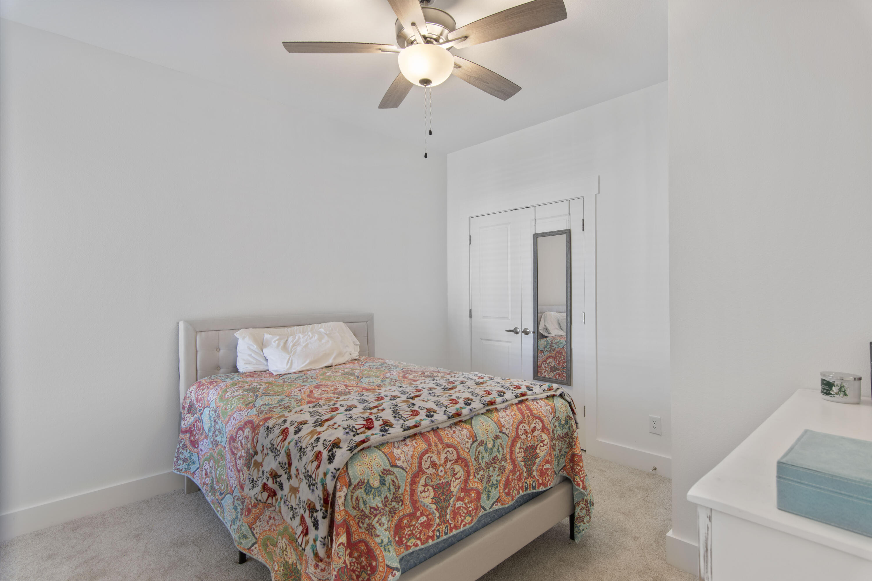 16 Date Palm Lane Freeport, FL 32439 - Photo 13 of 35 a bedroom with a bed and a chandelier