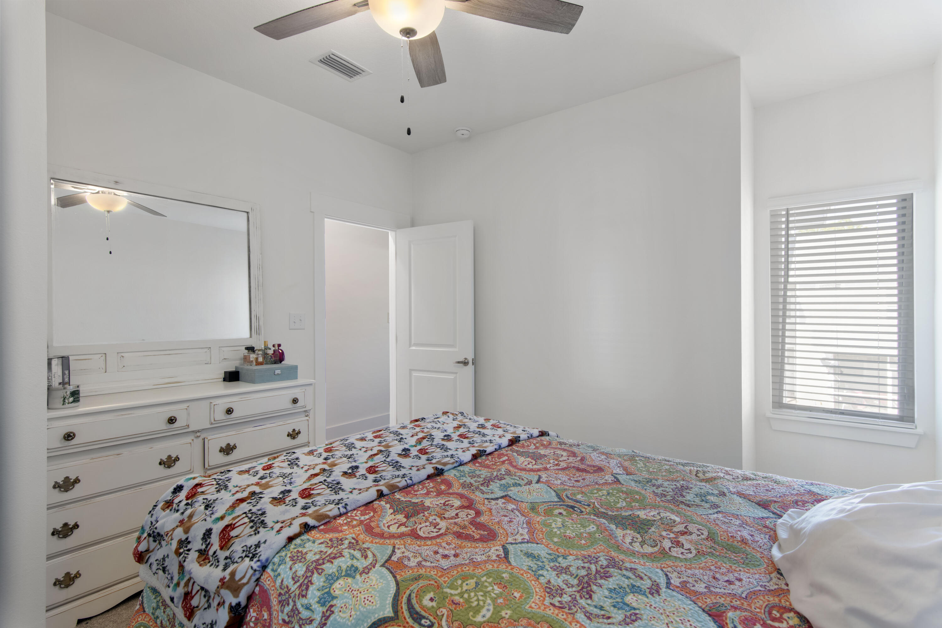 16 Date Palm Lane Freeport, FL 32439 - Photo 14 of 35 a bedroom with a bed and a dresser