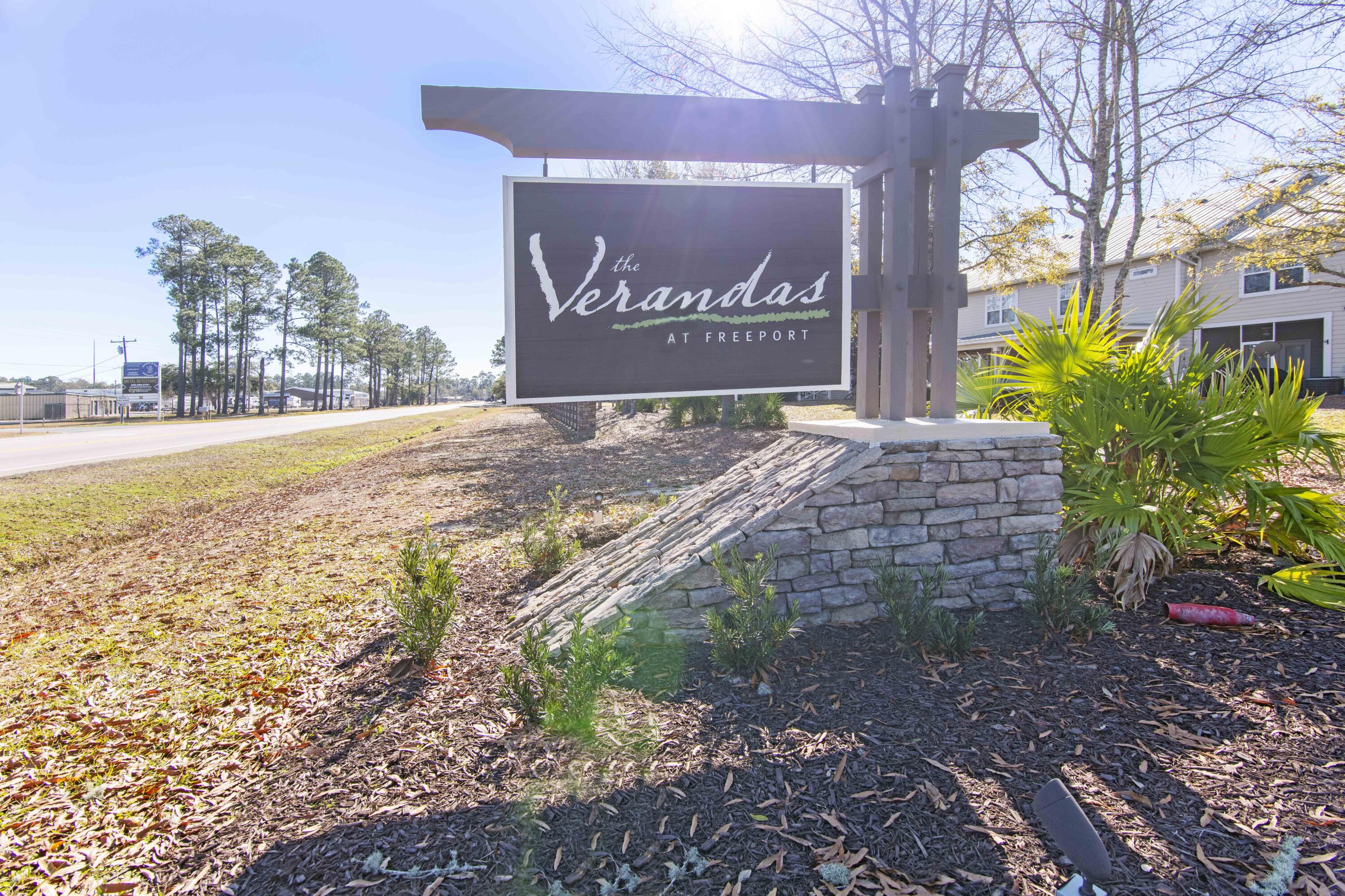 16 Date Palm Lane Freeport, FL 32439 - Photo 31 of 35 a sign that is on the side of the road