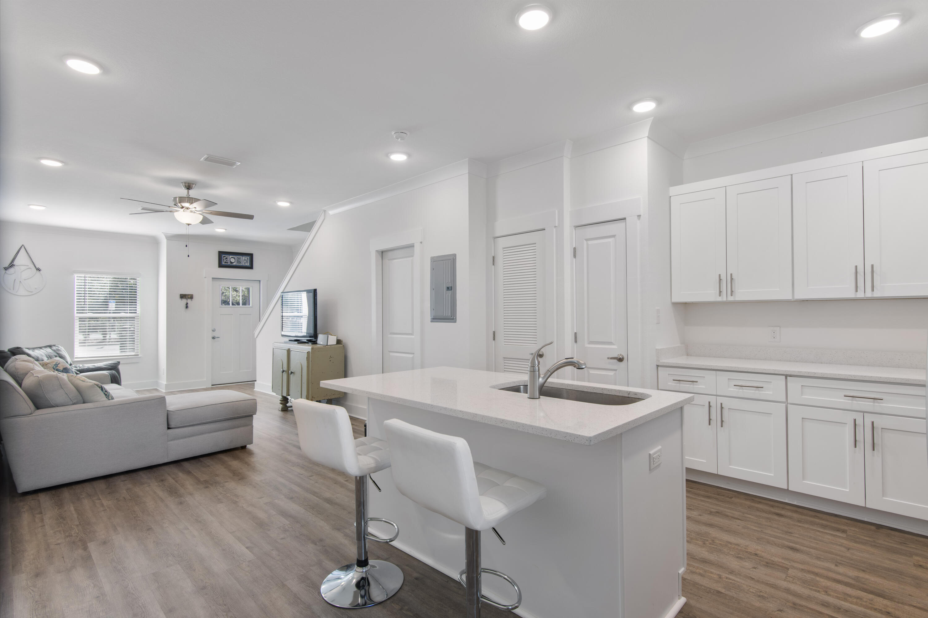 16 Date Palm Lane Freeport, FL 32439 - Photo 5 of 35 a large white kitchen with a sink and cabinets