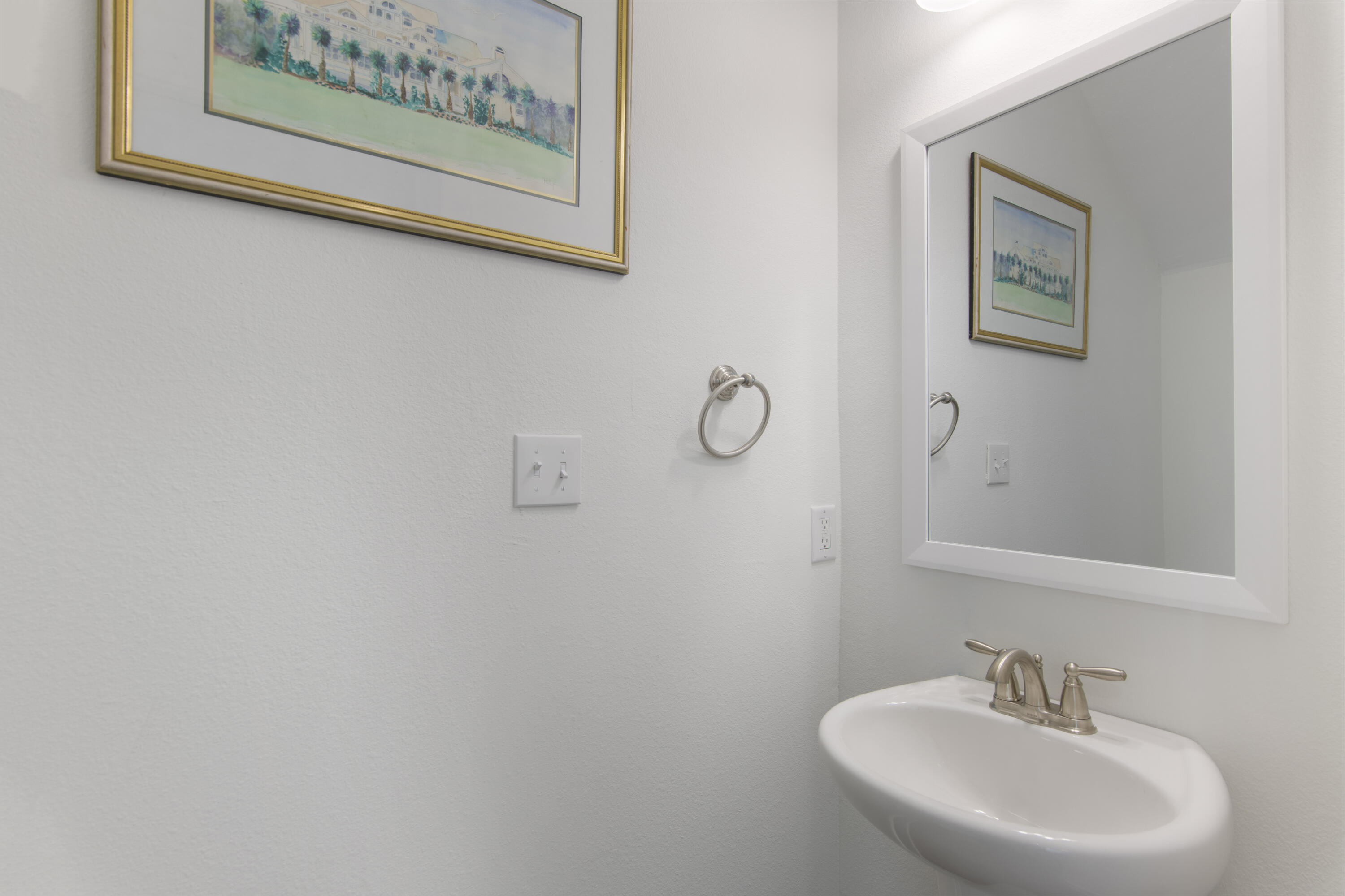 16 Date Palm Lane Freeport, FL 32439 - Photo 9 of 35 a bathroom with a sink and a mirror