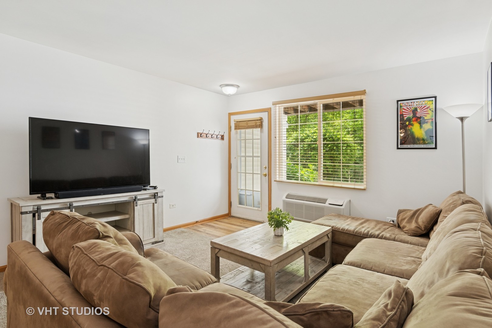 1504 McClure Road, Unit 1504 Aurora, IL 60505 - Photo 11 of 21 a living room with furniture and a flat screen tv