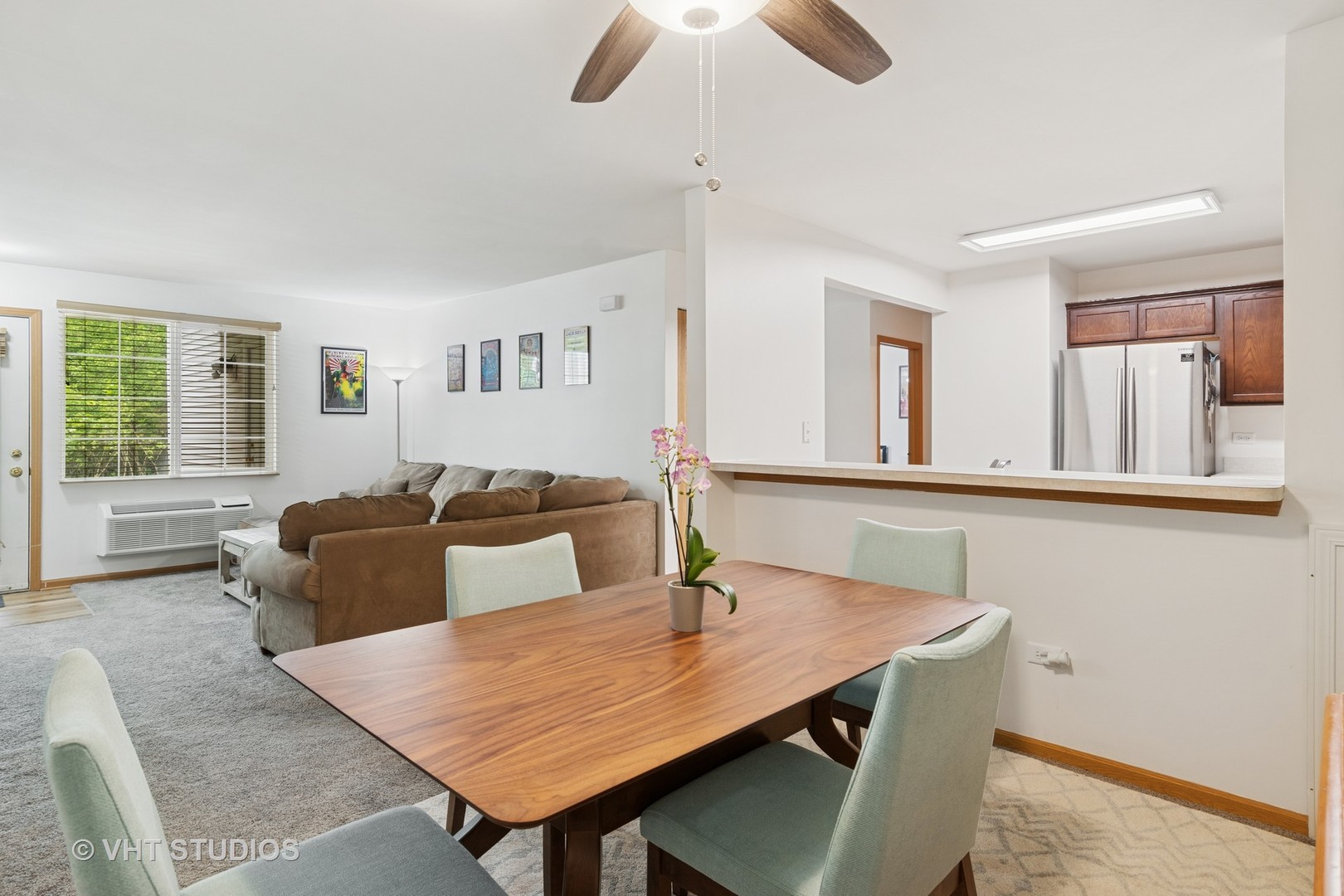 1504 McClure Road, Unit 1504 Aurora, IL 60505 - Photo 12 of 21 a living room with furniture and a window