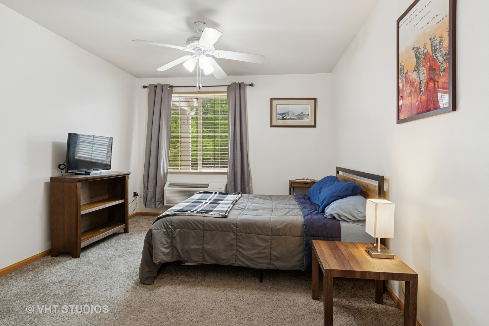 1504 McClure Road, Unit 1504 Aurora, IL 60505 - Photo 14 of 21 a bedroom with a bed and a tv