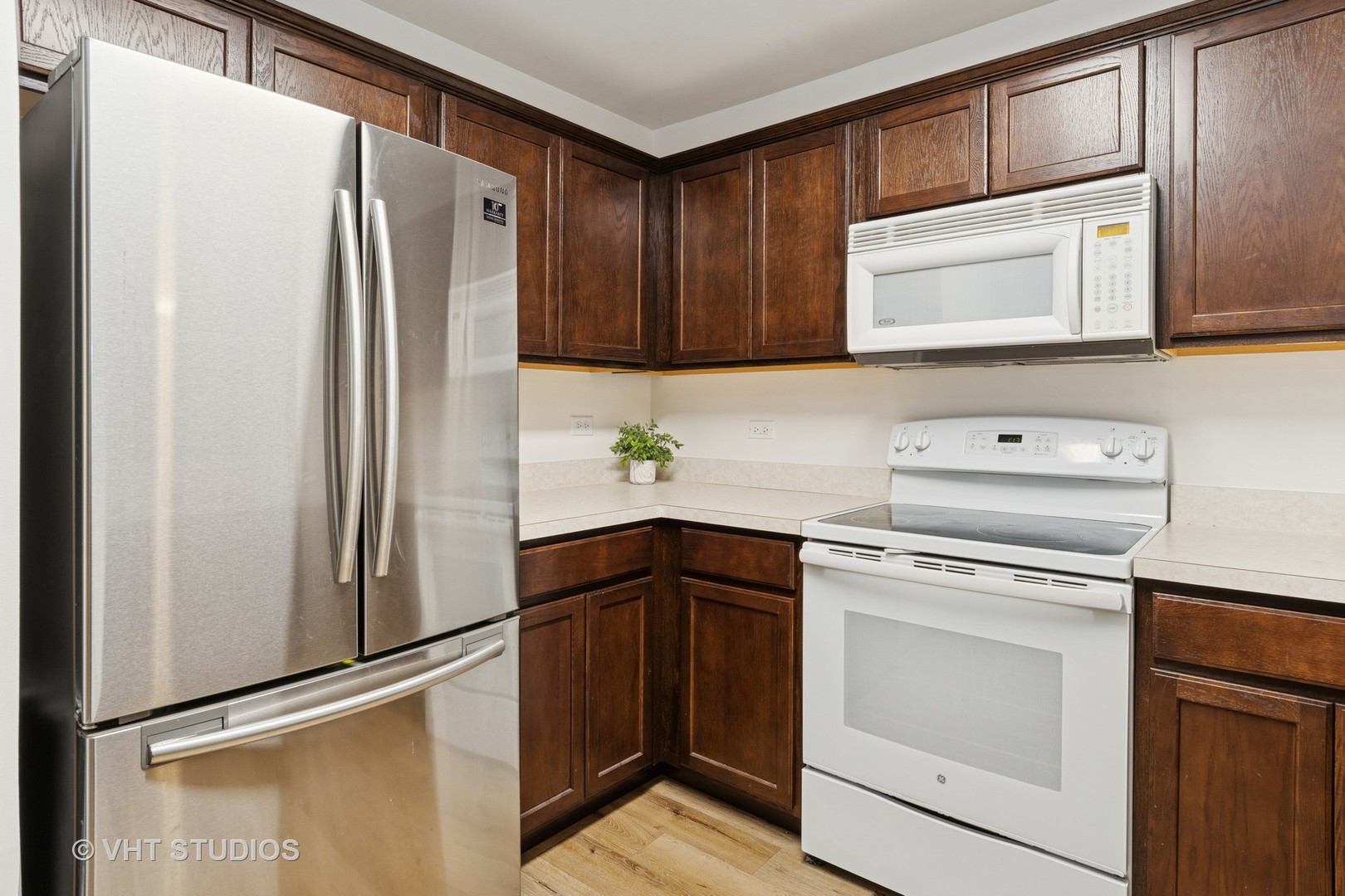 1504 McClure Road, Unit 1504 Aurora, IL 60505 - Photo 5 of 21 a kitchen with a refrigerator sink and cabinets